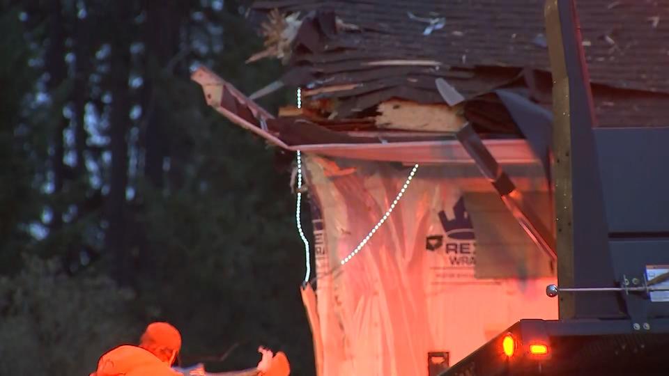 A woman was killed and her passenger has serious injuries after their car slammed into a house near Spanaway on May 4, 2023.