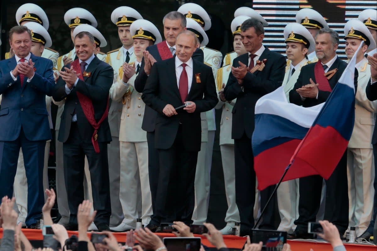 Vladimir Putin is applauded after speaking at a gala concert marking Victory Day in Sevastopol, Crimea, on 9 May 2014. (AP)