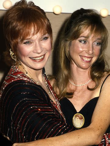 <p>Ron Gallela, Ltd. / Getty</p> Shirley MacLaine and daughter Sachi Parker attend the 31st Annual Thalians Ball on October 11, 1986 in Los Angeles, California.