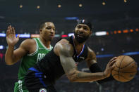 Boston Celtics forward Grant Williams, left, defends against Los Angeles Clippers forward Marcus Morris Sr. during the first half of an NBA basketball game in Los Angeles, Wednesday, Dec. 8, 2021. (AP Photo/Ashley Landis)