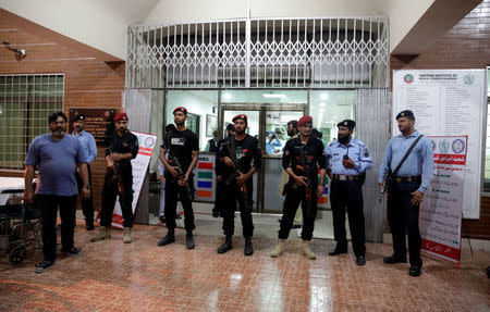 Police commandos stand guard in front of the cardiac center of Pakistan Institute of Medical Sciences (PIMS) where former Prime Minister Nawaz Sharif is shifted, in Islamabad, Pakistan July 29, 2018. REUTERS/Faisal Mahmood