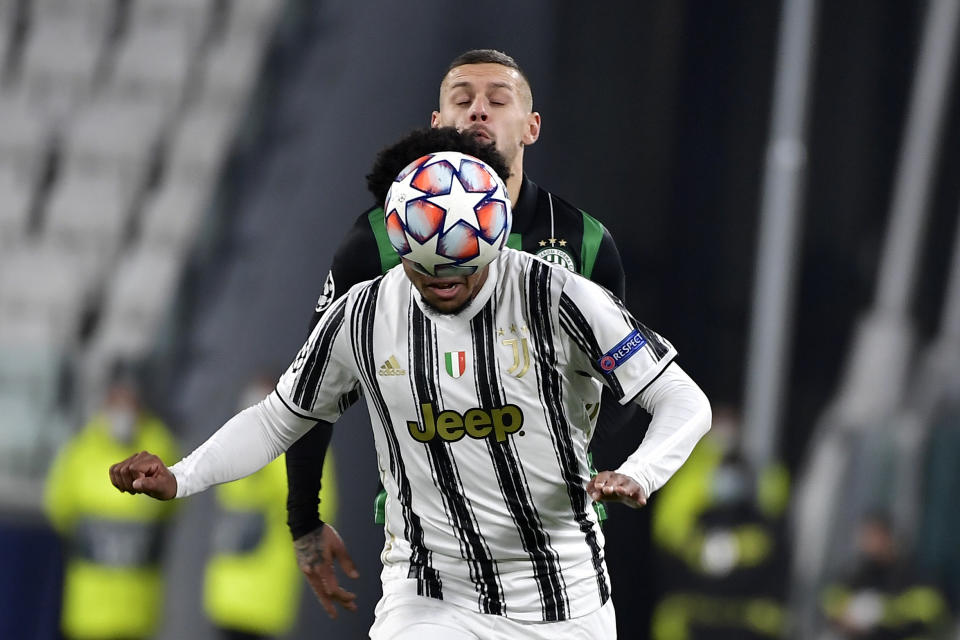 Juventus' Weston McKennie, foreground is challenged by Ferencvaros' Marcel Heister, during the Champions league, group G soccer match between Juventus and Ferencvaros, at the Allianz Stadium in Turin, Italy, Tuesday, Nov. 24, 2020. (Marco Alpozzi/LaPresse via AP)