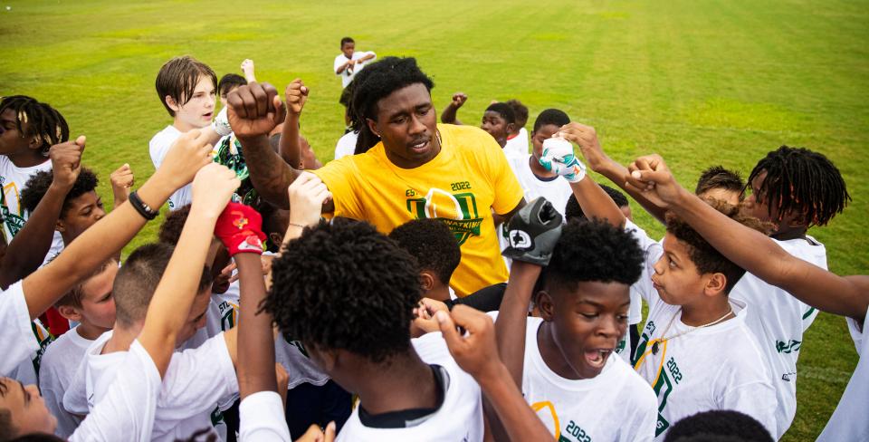 Sammy Watkins, a professional football player for the Green Bay Packers and graduate of South Fort Myers High School participates in a youth football camp that bears his name at South Fort Myers High School on Thursday, July 14, 2022. 