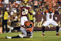 Cincinnati Bengals wide receiver Auden Tate (19) celebrates a touchdown during the third quarter of the team's NFL preseason football game against the Washington Redskins in Landover, Md., Thursday, Aug. 15, 2019. Bengals wide receiver Stanley Morgan (8) also celebrates, while Redskins defensive back D.J. White (29) watches. The Bengals won 23-13. (AP Photo/Susan Walsh)
