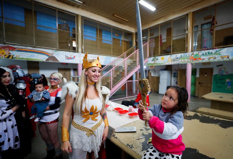 Argentine superheroes cheer up the children of prison inmates