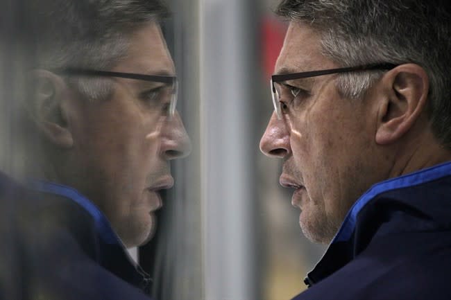 FILE -- Then Winnipeg Jets&#39; head coach Claude Noel keeps a close eye on his team on the second day of NHL hockey training camp Thursday, September 12, 2013 in Winnipeg.Noel has gone back to school. Actually, make that &quot;hockey university.&quot; THE CANADIAN PRESS/John Woods