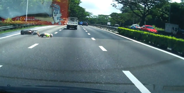 A reckless lorry driver crashes into a motorcyclist on PIE. (Screengrab)