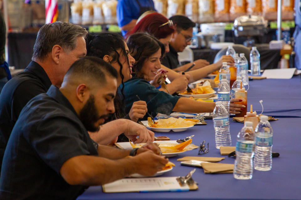 Judges taste test thee contestants' tamales on Nov. 12, 2023, in Phoenix.