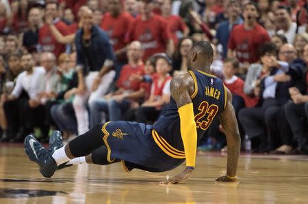 May 21, 2016; Toronto, Ontario, CAN; Cleveland Cavaliers forward LeBron James (23) falls down during the second quarter in game three of the Eastern conference finals of the NBA Playoffs against the Toronto Raptors at Air Canada Centre. Mandatory Credit: Nick Turchiaro-USA TODAY Sports