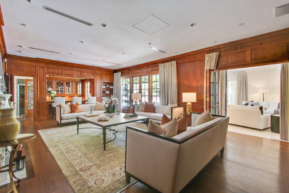 <p>This den has beautiful wood finishings and plenty of natural light. (Sotheby’s International Realty) </p>