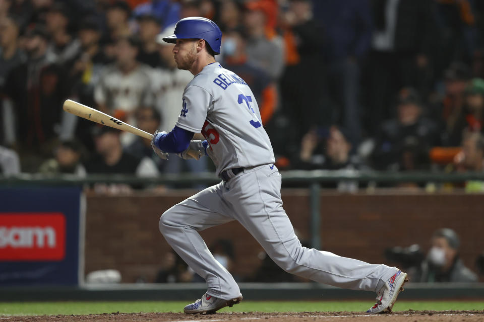 Los Angeles Dodgers' Cody Bellinger hits an RBI-single against the San Francisco Giants during the ninth inning of Game 5 of a baseball National League Division Series Thursday, Oct. 14, 2021, in San Francisco. (AP Photo/John Hefti)