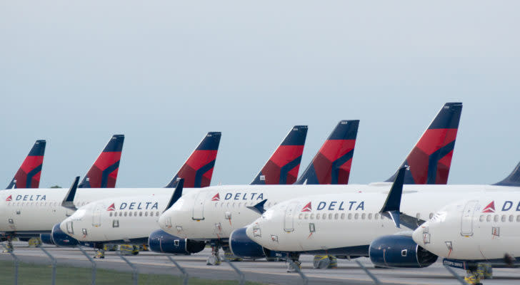 Delta Airplanes sit in a row at Kansas City International Airport