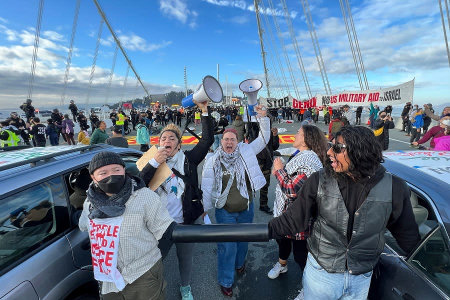 Demonstrators shut down the San Francisco Oakland Bay Bridge in conjunction with the APEC Summit taking place Thursday, Nov. 16, 2023, in San Francisco. (AP Photo/Noah Berger)