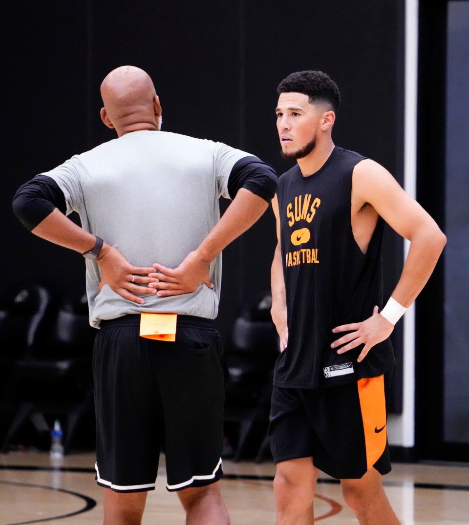 Sep 27, 2022; Phoenix, Arizona, USA; Phoenix Suns head coach Monty Williams talks to guard Devin Booker during practice at the Verizon 5G Performance Center.