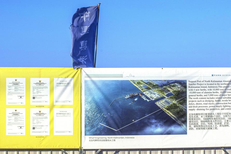 Signage shows the master plan of the port which is being built at the construction site of the Kalimantan Industrial Park Indonesia (KIPI) in Mangkupadi, North Kalimantan, Indonesia on Thursday, Aug. 24, 2023. The vast industrial park being built on the tropical island of Borneo that has attracted billions of dollars in foreign and domestic investment is damaging the environment in an area where endangered animals live and migrate. (AP Photo/Yusuf Wahil)