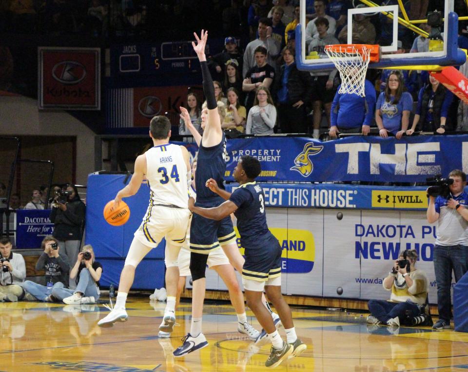 South Dakota State guard Alex Arians works in the post against Oral Roberts' Connor Vanover and Max Abmas on Saturday, Feb. 25, 2023.