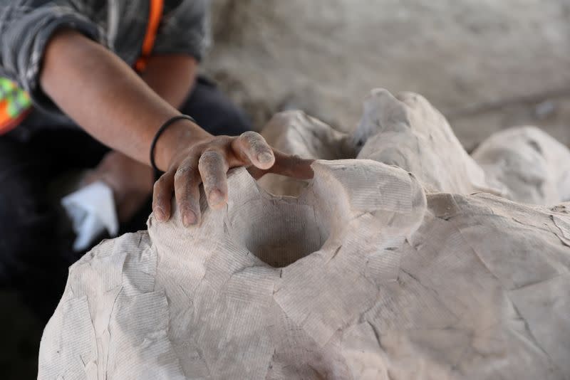 Archaeologists from the National Institute of Anthropology and History (INAH) work at a site where they are unearthing remains of mammoths, in Zumpango