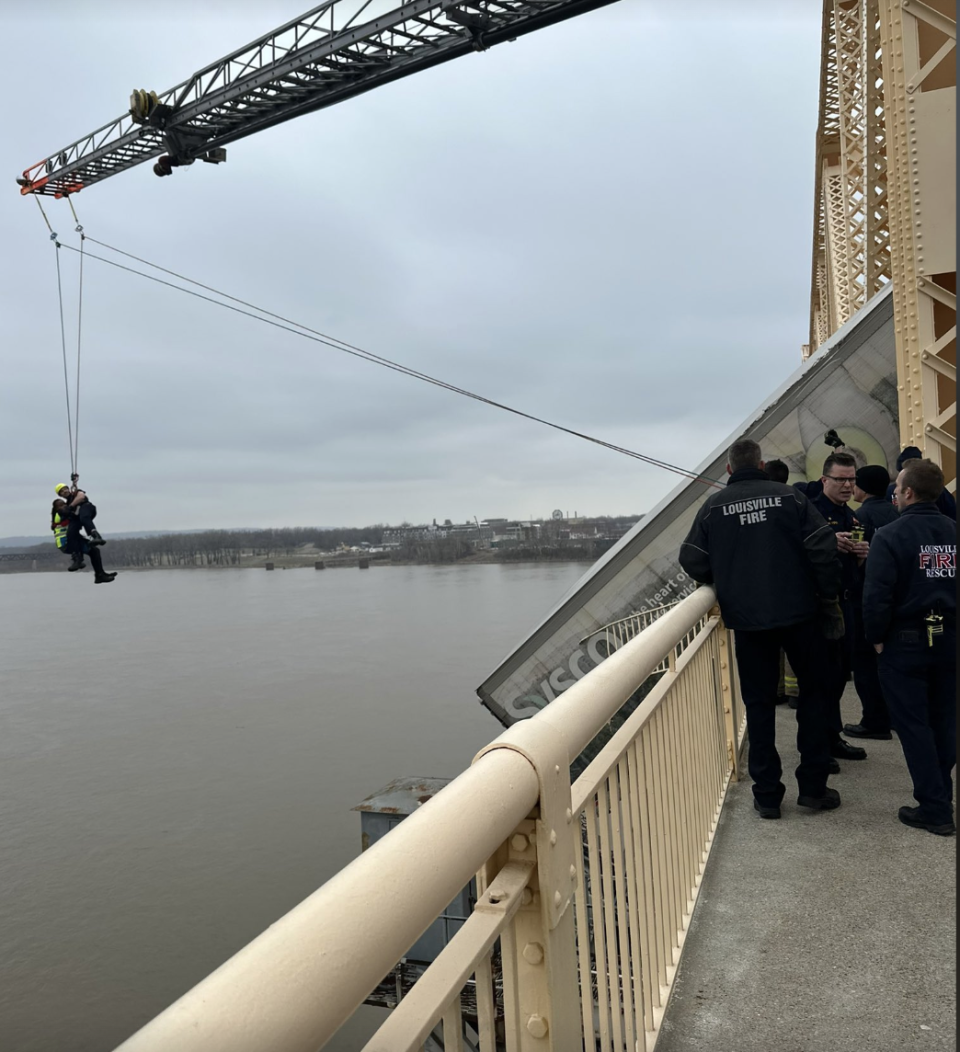 Louisville firefighters rescue a driver from a semi-cab that crashed and was dangling over a bridge. / Credit: Louisville Mayor Craig Greenberg