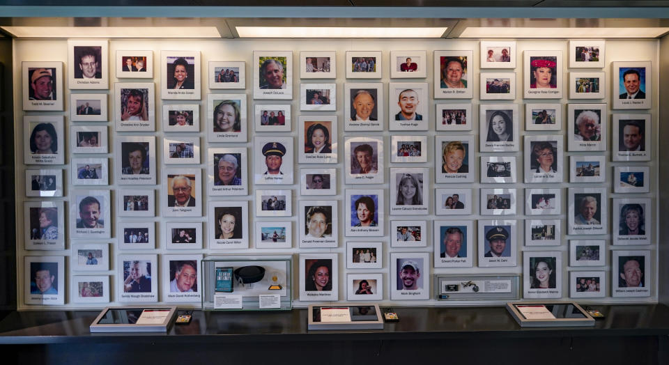 A collection of photographs of the 40 people that died in the crash of Flight 93 in the 9/11 terrorist attacks of 2001 is one the exhibits at the visitors center of the Flight 93 National Memorial, Saturday, May 8, 2021, in Shanksville, Pa. The organization "Friends of Flight 93" is creating a new annual award for heroism that aims to reward selfless acts of heroism, but also to educate the public on what happened when those aboard hijacked Flight 93, learned of the attacks that had just occurred in New York and Washington D.C. (AP Photo/Keith Srakocic)