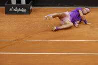 Spain's Rafael Nadal falls to ground after tripping over a lifted line of the court, during his final match against Djokovic at the Italian Open tennis tournament, in Rome, Sunday, May 16, 2021. (AP Photo/Gregorio Borgia)