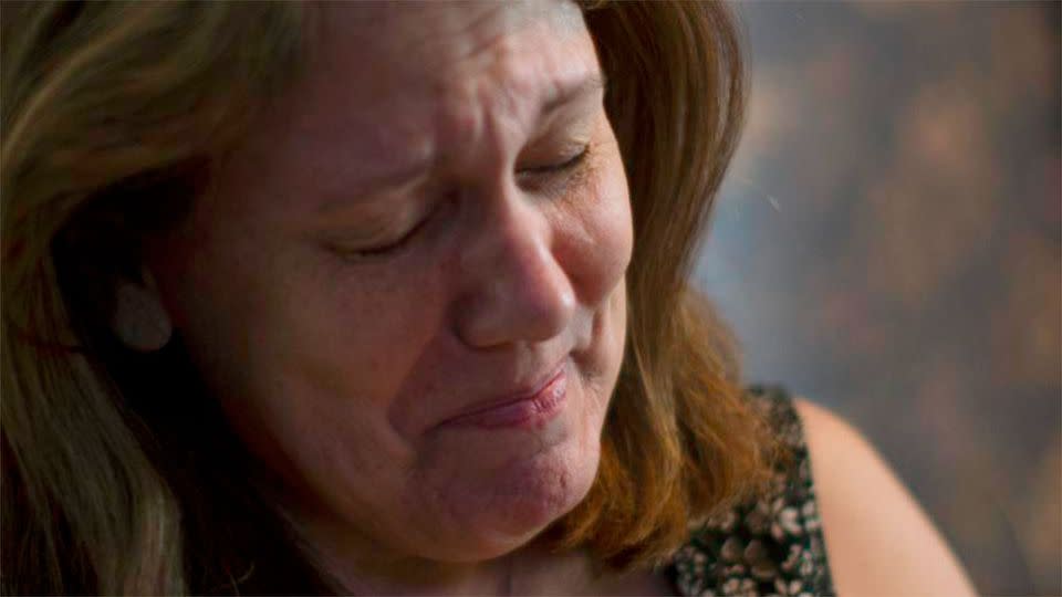 Mrs. Shuemake holds back tears as she speaks of her daughter who died of a suspected heroin overdose. Photo: AP/John Minchillo