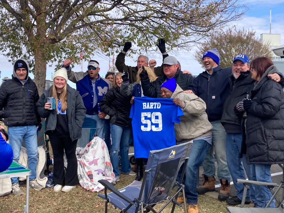 Former Teammates and friends of former Memphis linebacker Danton Barto gather at a pregame tailgate before the Tigers host North Alabama. Barto's No. 59 was retired Saturday at halftime