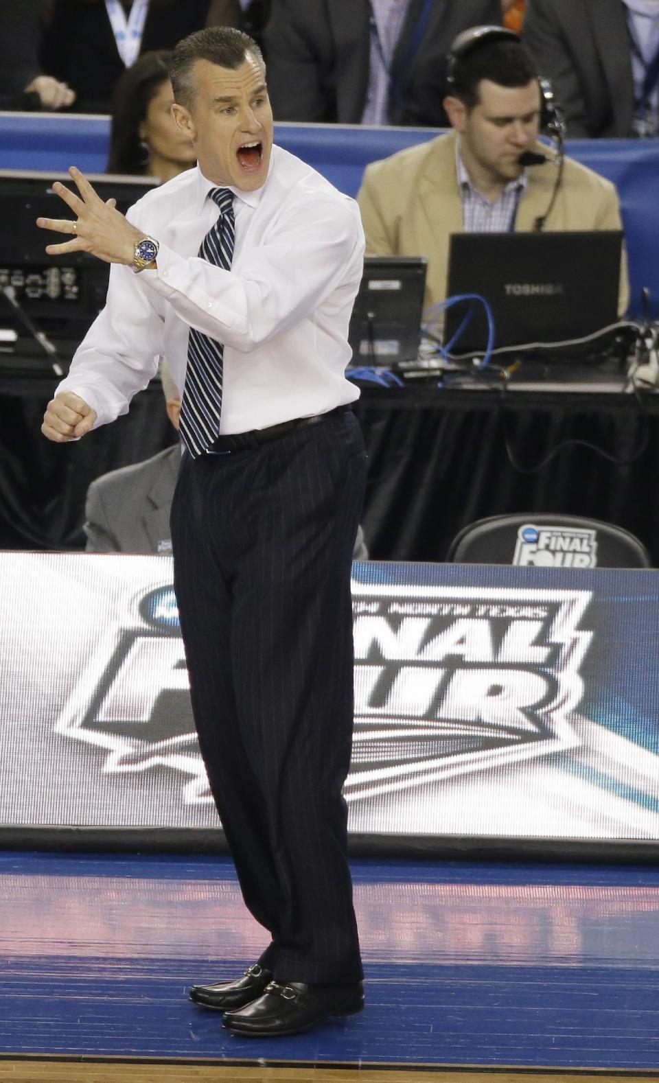 Florida head coach Billy Donovan reacts during the first half of an NCAA Final Four tournament college basketball semifinal game against Connecticut Saturday, April 5, 2014, in Arlington, Texas. (AP Photo/Tony Gutierrez)