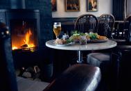 <p><span>Sitting happily on the water's edge, <a rel="nofollow noopener" href="http://starandgarter.squarespace.com/" target="_blank" data-ylk="slk:this revamped coastal pub;elm:context_link;itc:0;sec:content-canvas" class="link ">this revamped coastal pub</a> has a great dining room overlooking the harbour, serving everything from pickled mackerel to slow cooked pork shoulder. The decor is rustic chic, with pared back wooden floors, leather armchairs and colourful cushions, ideal after a walk along the bay. [Photo: Star & Garter]</span> </p>