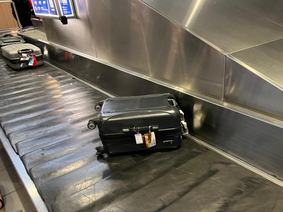 suitcase on conveyer belt in airport