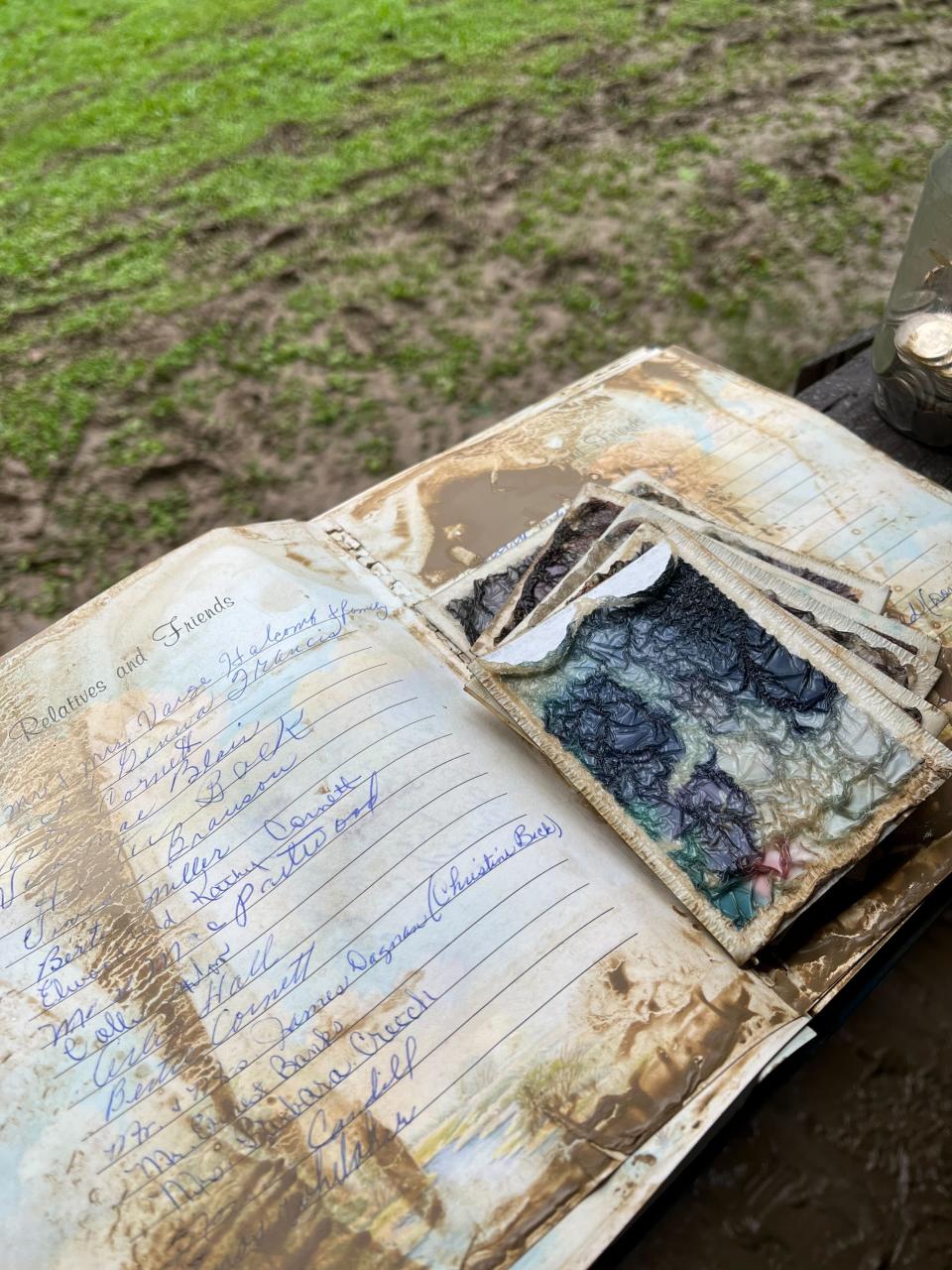 Many Appalachians cherish a "family bible," a book recording details about the family lineage going back generations. Bolen's family dries out theirs after it was ruined by the flood, Knott County, Kentucky, July 29, 2022.<span class="copyright">Shared by Lakyn Bolen</span>