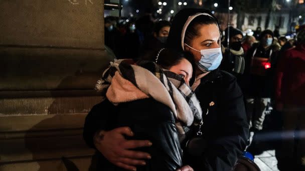 PHOTO: Women hug during a protest in front of the Law and Justice party office, Jan 26, 2022, in Krakow, Poland. (Omar Marques/Getty Images, FILE)