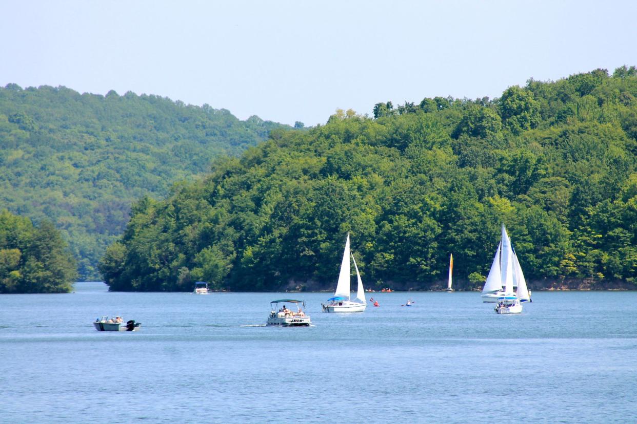 sailboats and motorboats on lake