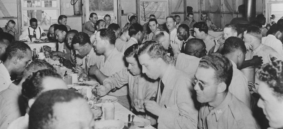 US Army soldiers eating in mess hall World War II