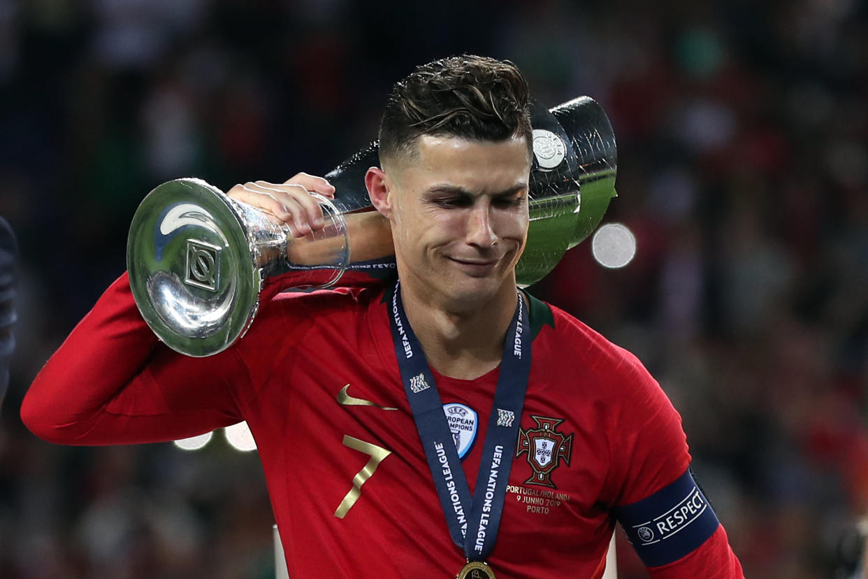 Portugal's forward Cristiano Ronaldo holds the trophy after winning the UEFA Nations League Final football match between Portugal and Netherlands. (Getty)