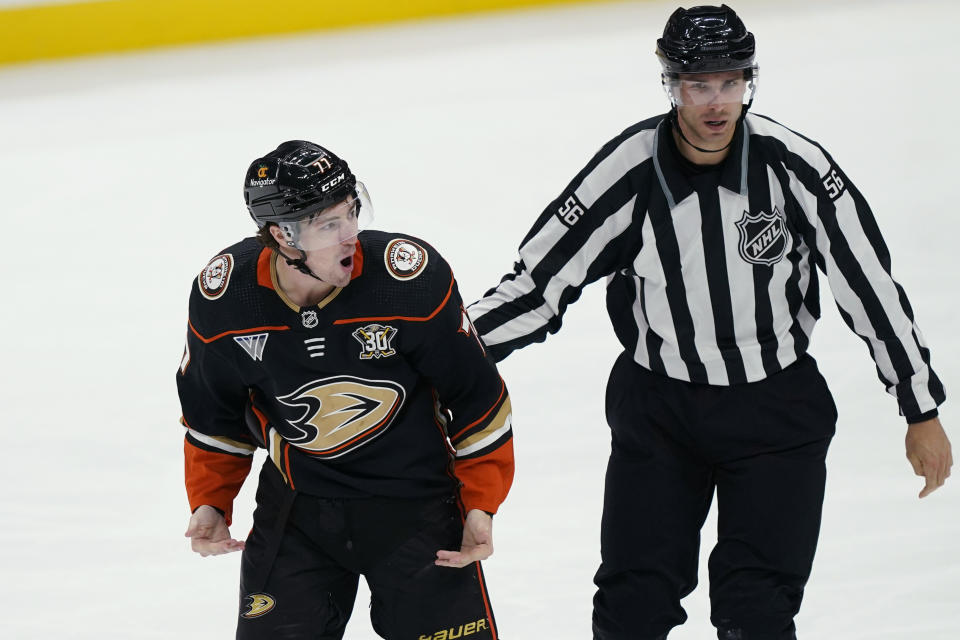 Anaheim Ducks right wing Frank Vatrano reacts while being escorted off the ice by linesman Julien Fournier after an altercation with Arizona Coyotes defenseman Sean Durzi during the third period of an NHL hockey game Wednesday, Nov. 1, 2023, in Anaheim, Calif. (AP Photo/Ryan Sun)