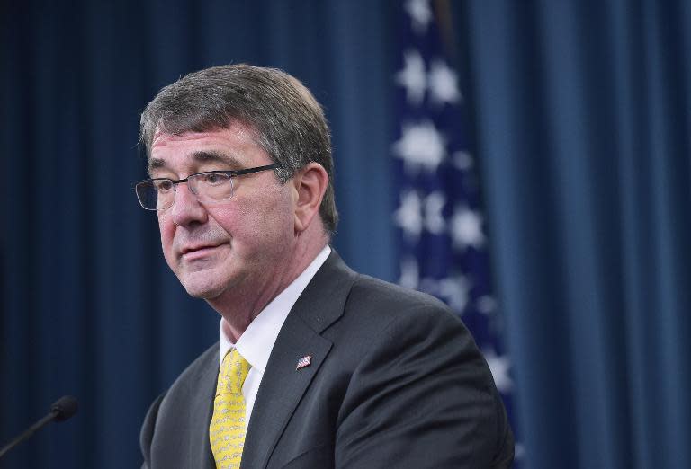 US Defense Secretary Ashton Carter told his Philippine counterpart that Washington's pledge to defend the Pacific nation remains "ironclad" and called for an end to land reclamation in the South China Sea, officials say