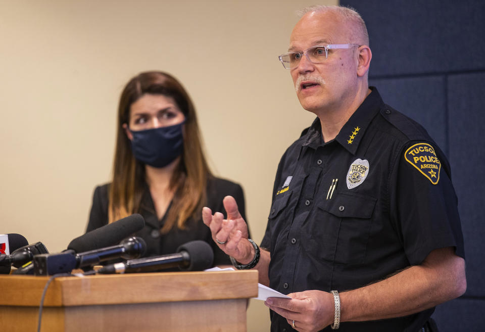 Tucson Police Chief Chris Magnus, right, speaks as Mayor Regina Romero listens during a press conference, Wednesday, June 24, 2020, in Tucson, Ariz. Chief Magnus offered his resignation after the death of a 27-year-old man who died while handcuffed and placed face-down, resulting in the resignation of three officers the chief said had violated department policy. The city council and city manager have to approve resignation. The city council and city manager have to approve resignation. The medical examiner’s office didn’t determine a manner of death but said Carlos Ingram-Lopez had died of sudden cardiac arrest while intoxicated by cocaine and physically restrained. (Josh Galemore/Arizona Daily Star via AP)