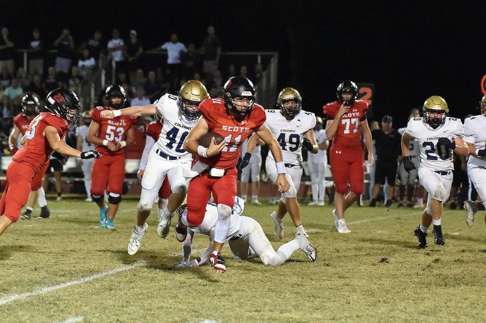 Saint Andrew's quarterback Dylan Mayers scrambles for extra yards against Clearwater Christian on Nov. 10, 2023.