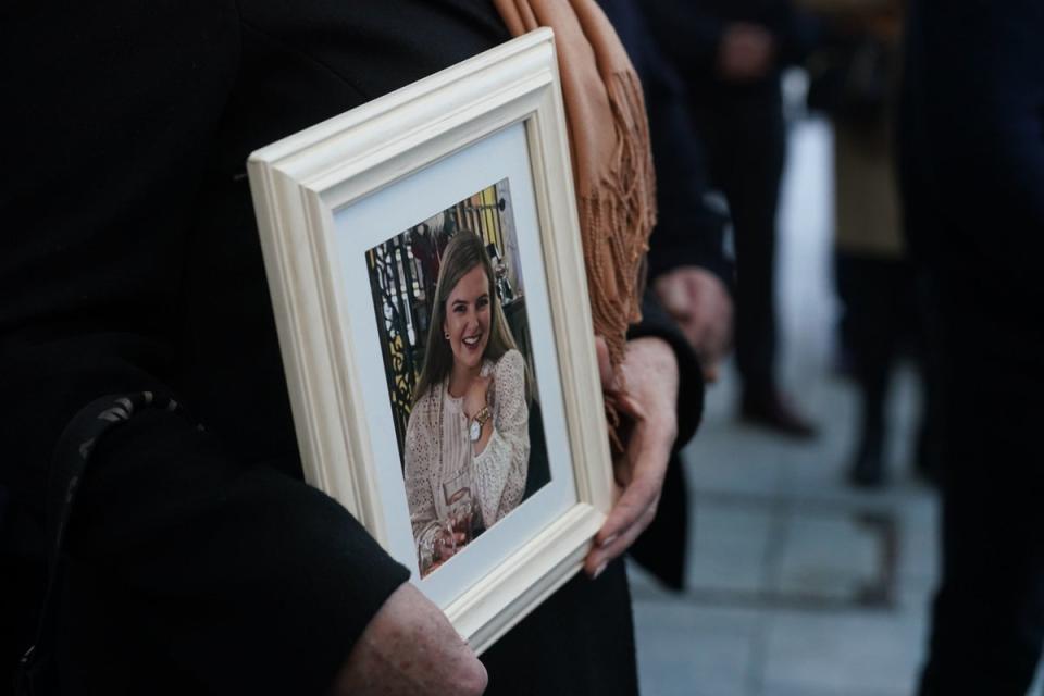 Ashling’s mother Kathleen, holds a framed photograph of her daughter (PA)