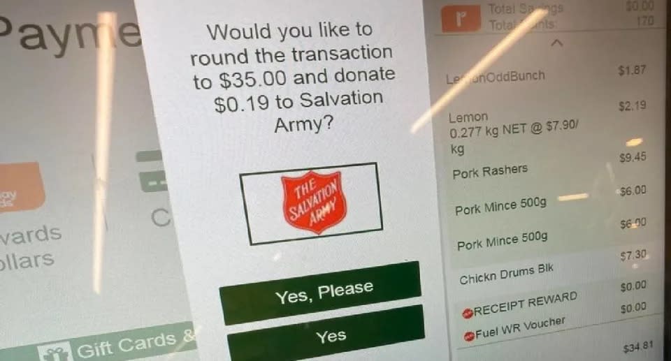 Request for charity donation on Woolworths self-serve checkout screen