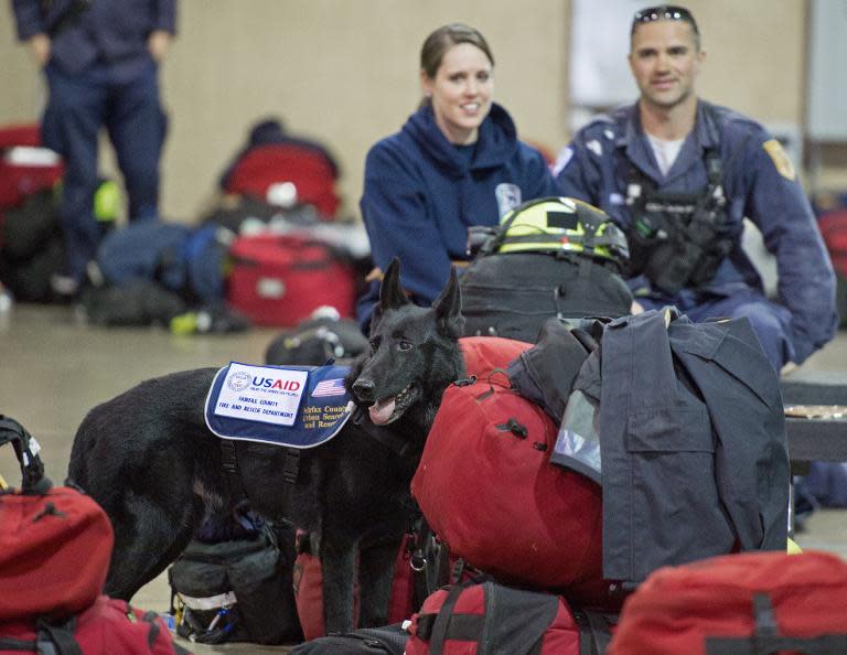 Members of Virginia Task Force 1 pack and prep their gear on April 25, 2015 at their Chantilly, Virginia, headquarters, before deploying to conduct search and rescue operations in Nepal