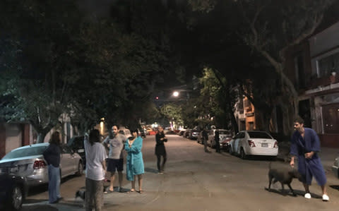 Residents in Mexico City briefly left their properties after last night's tremor - Credit: CLAUDIA DAUT/ REUTERS