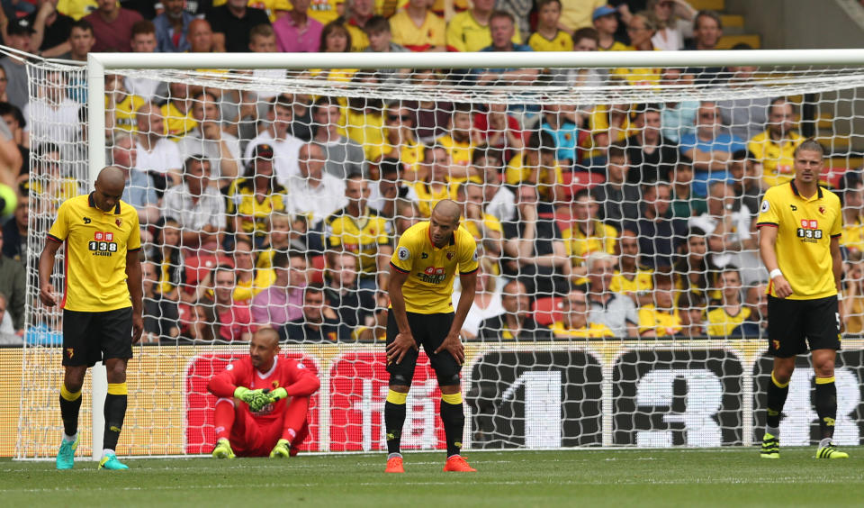 Football Soccer Britain - Watford v Arsenal - Premier League - Vicarage Road - 27/8/16 Watford players look dejected after Arsenal's Alexis Sanchez scores their second goal Action Images via Reuters / Andrew Boyers Livepic EDITORIAL USE ONLY. No use with unauthorized audio, video, data, fixture lists, club/league logos or "live" services. Online in-match use limited to 45 images, no video emulation. No use in betting, games or single club/league/player publications. Please contact your account representative for further details.