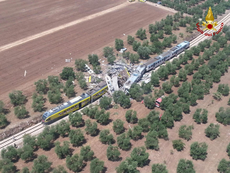 Two passenger trains are seen after a collision in the middle of an olive grove in the southern village of Corato, near Bari, Italy, in this handout pictures released by Italian Firefighters July 12, 2016. Italian Firefighters/Handout via Reuters ATTENTION EDITORS - THIS PICTURE WAS PROVIDED BY A THIRD PARTY. FOR EDITORIAL USE ONLY. TPX IMAGES OF THE DAY