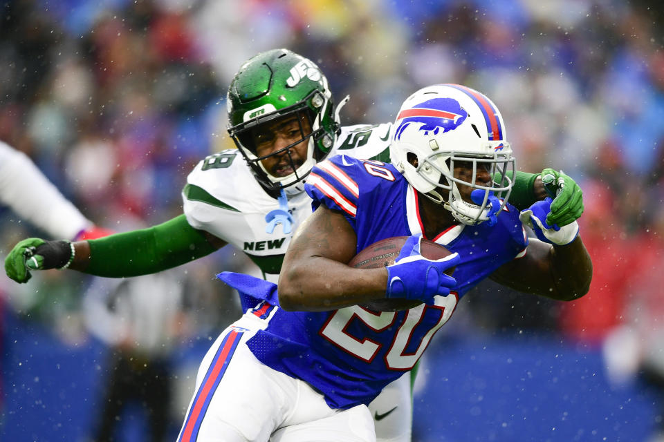 Buffalo Bills running back Frank Gore (20) runs past New York Jets outside linebacker James Burgess (58) during the first half of an NFL football game Sunday, Dec. 29, 2019, in Orchard Park, N.Y. (AP Photo/David Dermer)