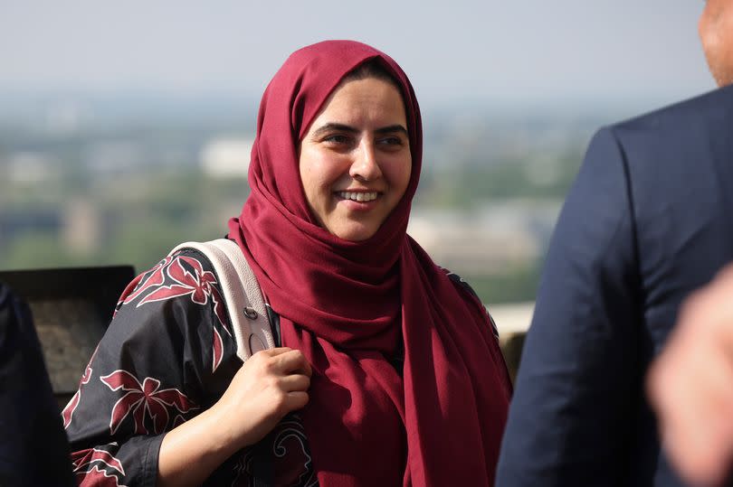 The new leader of Nottingham City Council Neghat Khan pictured at Nottingham Castle, wearing a red and black patterned top