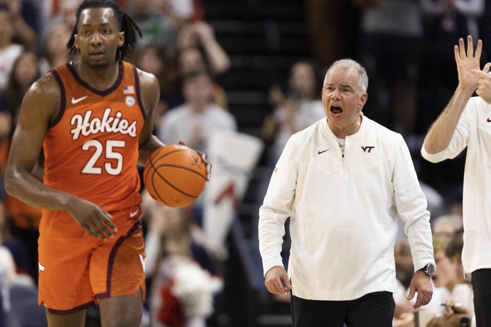 Virginia Tech head coach Mike Young yells to his players during the first half of an NCAA college basketball game against Virginia in Charlottesville, Va., Wednesday, Jan. 18, 2023. (AP Photo/Mike Kropf)