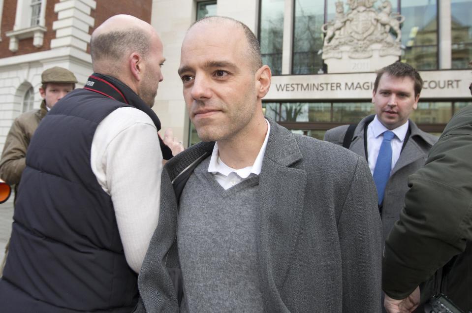 Former Barclays Bank employee Stylianos Contogoulas leaves Westminster Magistrates court after appearing on charges of conspiracy to defraud in relation to the manipulation of the dollar Libor rate in London, Wednesday, Feb. 26, 2014. (AP Photo/Alastair Grant)