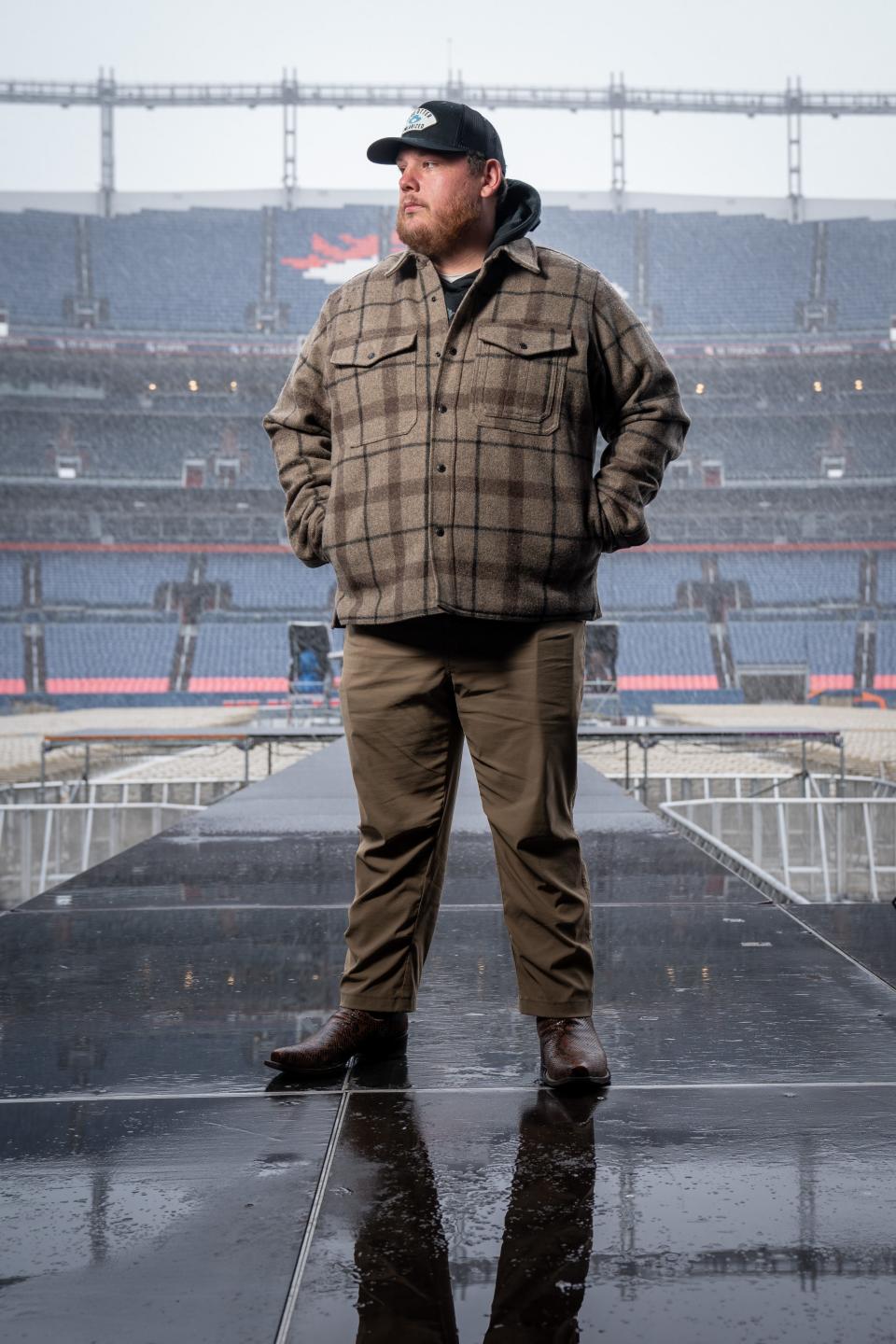 Luke Combs poses for a portrait on the stage at Empower Field at Mile High in Denver, Colo., Friday, May 20, 2022.