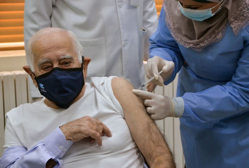 Jordanian Doctor Dawoud Hananiah, receives the first COVID-19 vaccine in Jordan, at a medical center in Amman